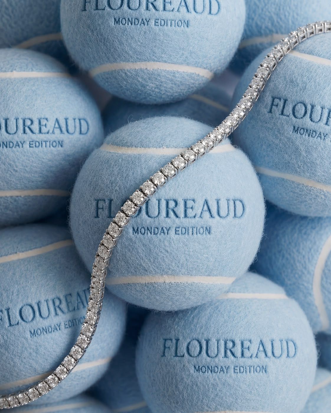 Monday Edition — the Riviera resting on blue felt tennis balls embroidered Floureaud